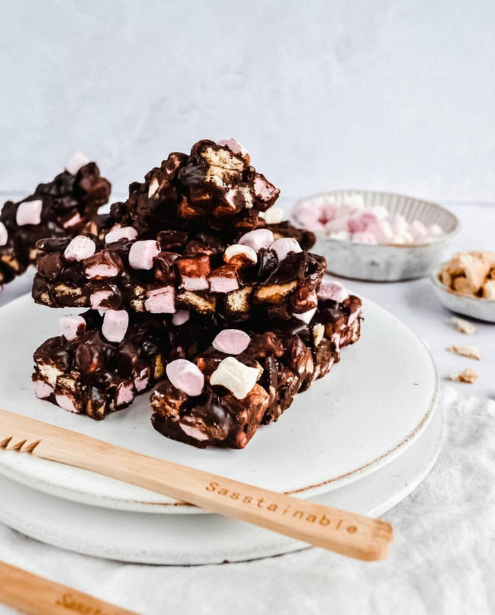 A stack of rocky road slices on a plate