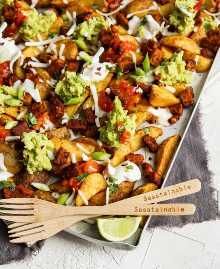 Potato wedges topped with avocado, bacon, sour cream and cheese