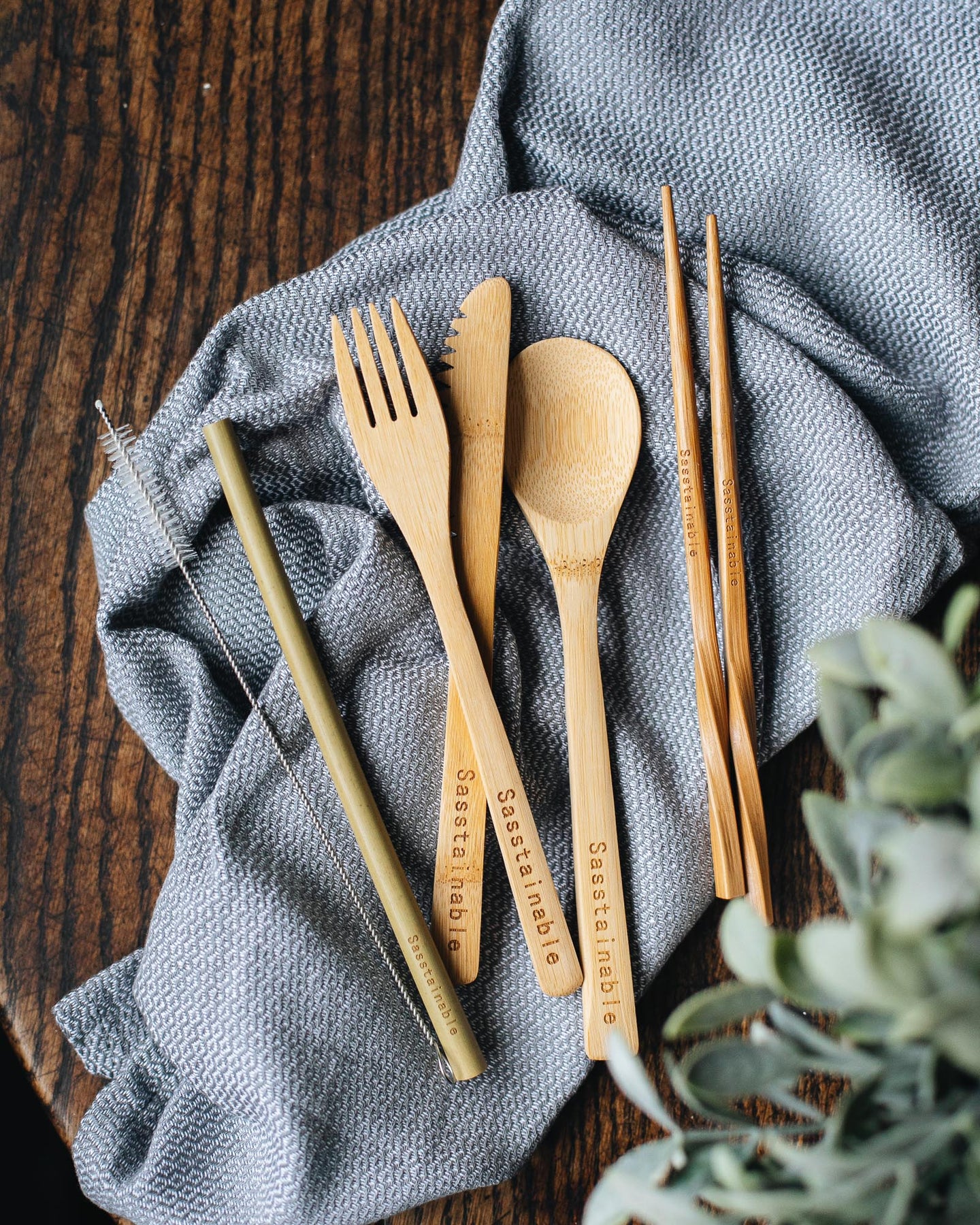 Bamboo cutlery against a blue cloth
