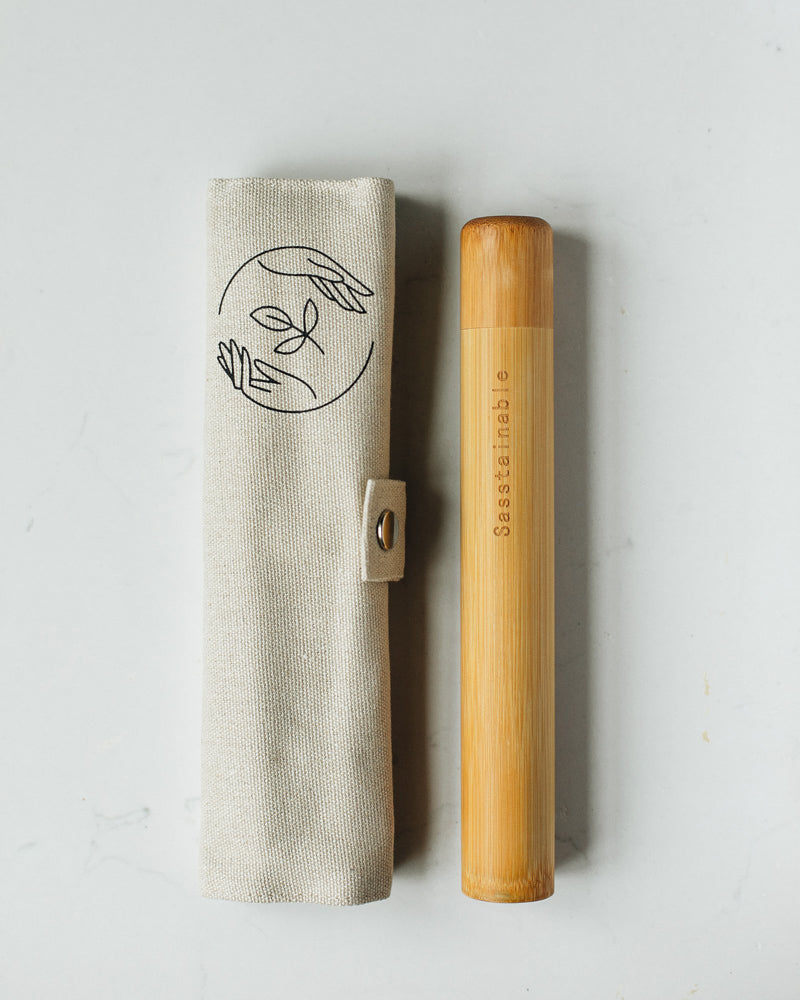 Rolled up beige canvas case with bamboo tube, featuring Sasstainable logo